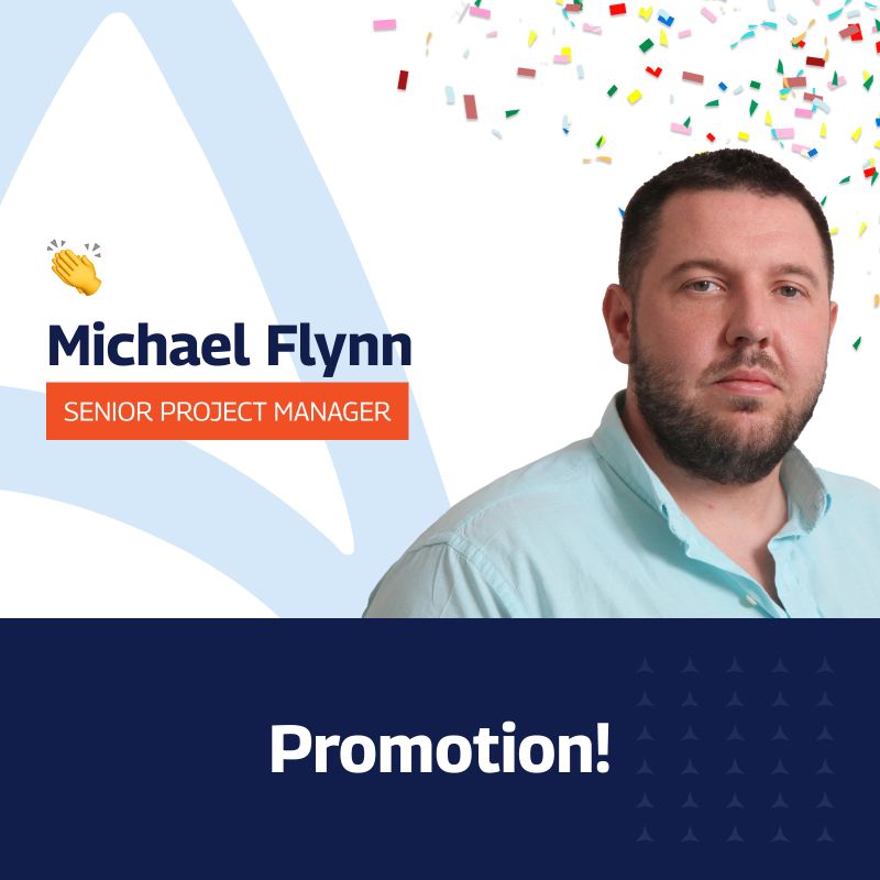 A celebratory graphic announcing Michael Flynn’s promotion to Senior Project Manager. The image features a professional portrait of Michael on the right, with colorful confetti in the top right corner. His name and new title, “Senior Project Manager,” are displayed on the left with a small clapping hands emoji. The text “Promotion!” is prominently shown in bold white letters on a dark blue background at the bottom of the image.