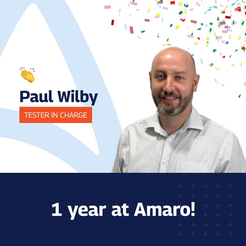 The image celebrates Paul Wilby’s first anniversary at Amaro, featuring his portrait with a smile, dressed in a striped shirt. He’s identified as the “Tester in Charge.” The background is festive with a large white triangle and colorful confetti, alongside the text “1 year at Amaro!” in bold lettering. The overall design uses a blue and white colour scheme with star patterns at the bottom.