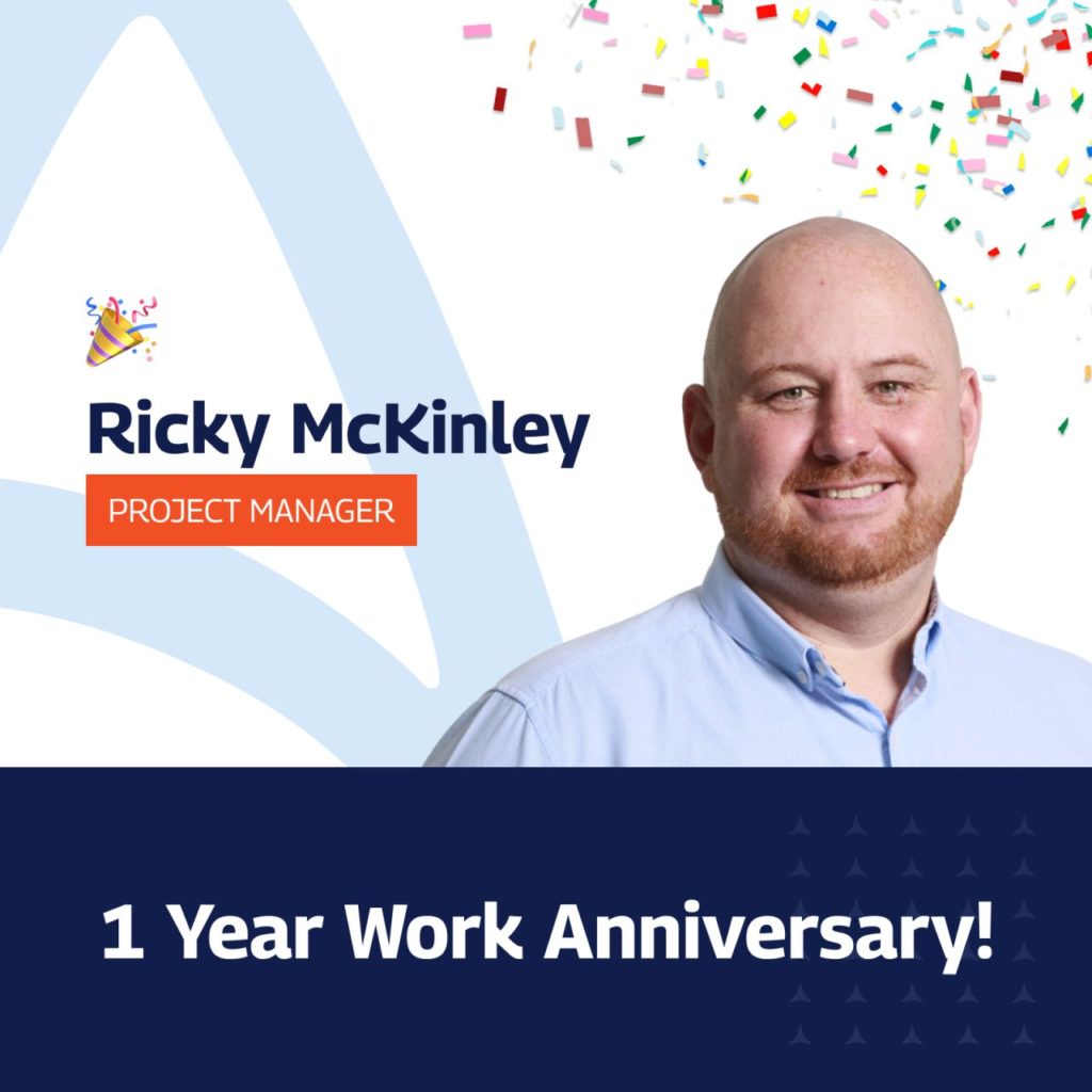 Smiling man with a beard and shaved head wearing a light blue collared shirt, identified as Ricky McKinley, Project Manager. The image includes celebratory confetti at the top and a party hat emoji next to his name. Below the portrait, the text reads '1 Year Work Anniversary!' celebrating his milestone."