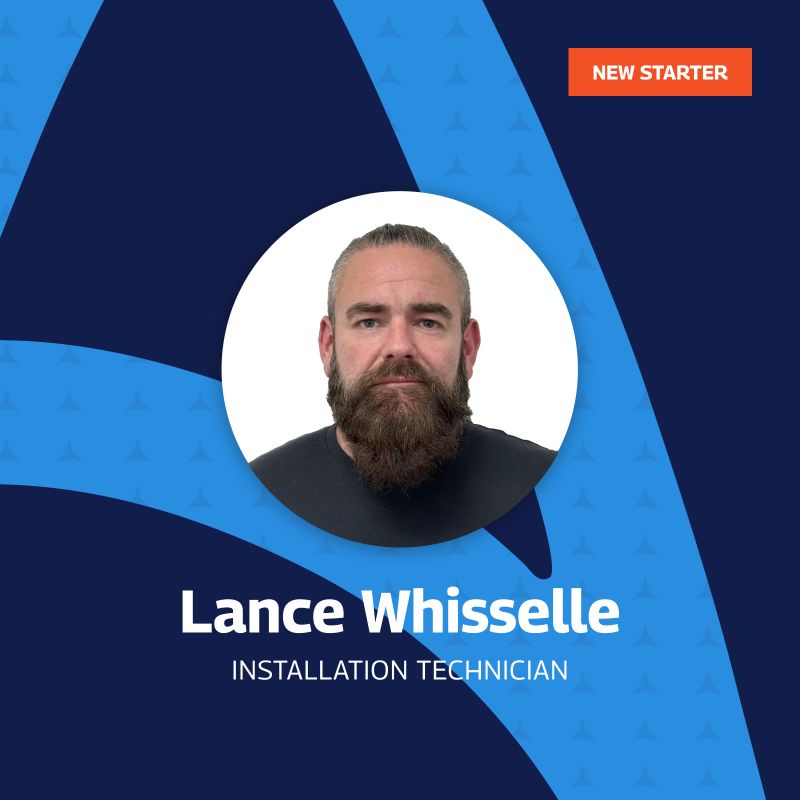 New Starter Announcement featuring Lance Whisselle, Installation Technician at Amaro, with a beard and a thoughtful expression, framed in a circular cutout on a blue graphic background with triangle patterns.